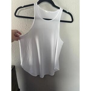 Fabletics thin white higher neck tank. No size but fits like a M. No visible sta